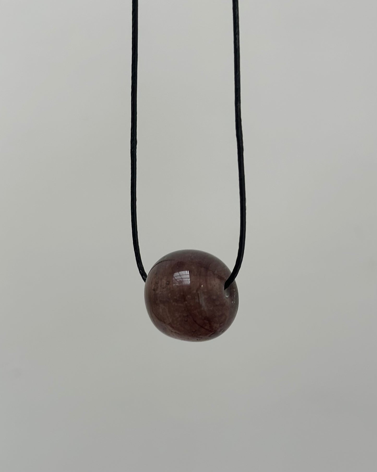CLEAR MAUVE GLASS SPHERE NECKLACE