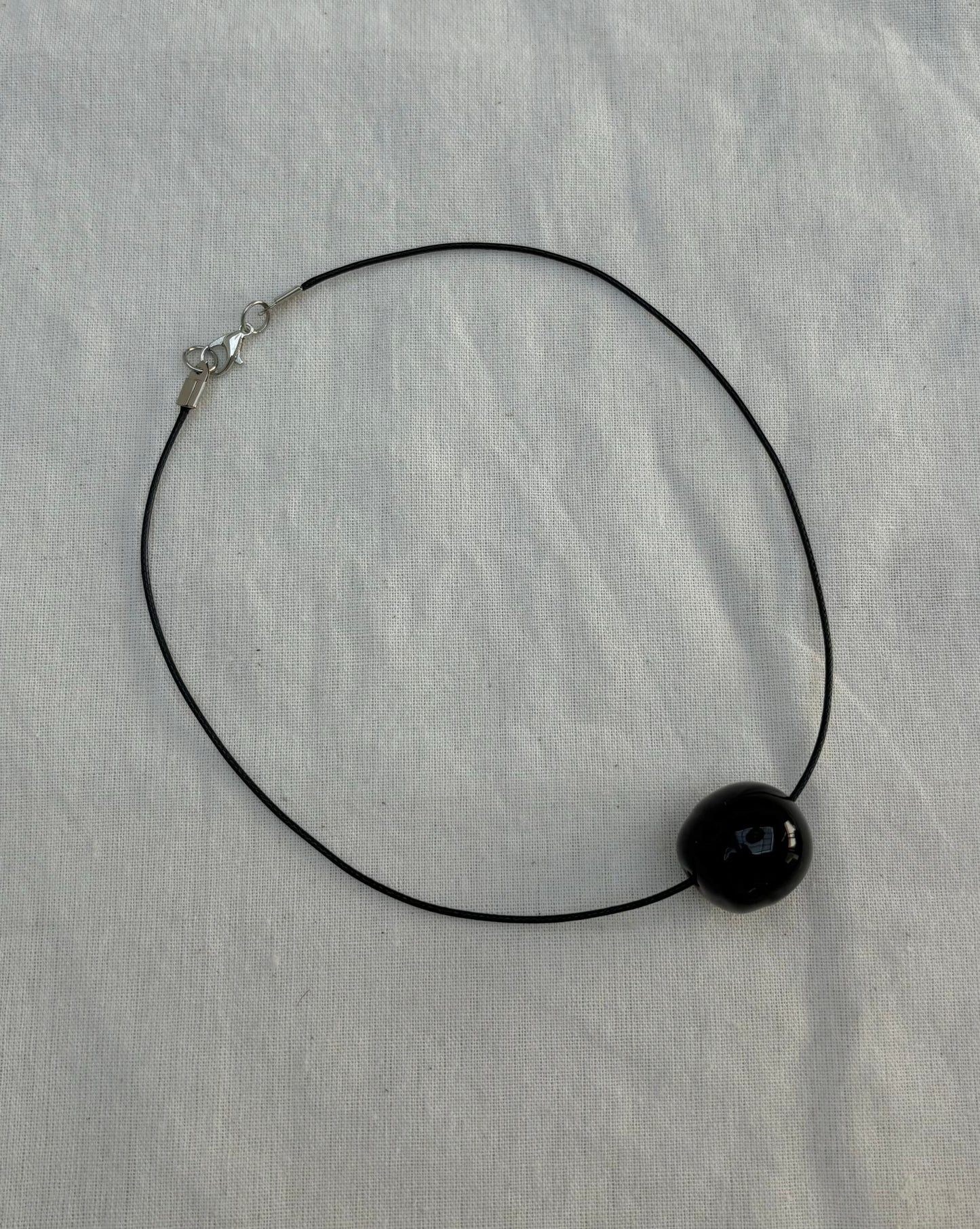 BLACK GLASS SPHERE NECKLACE